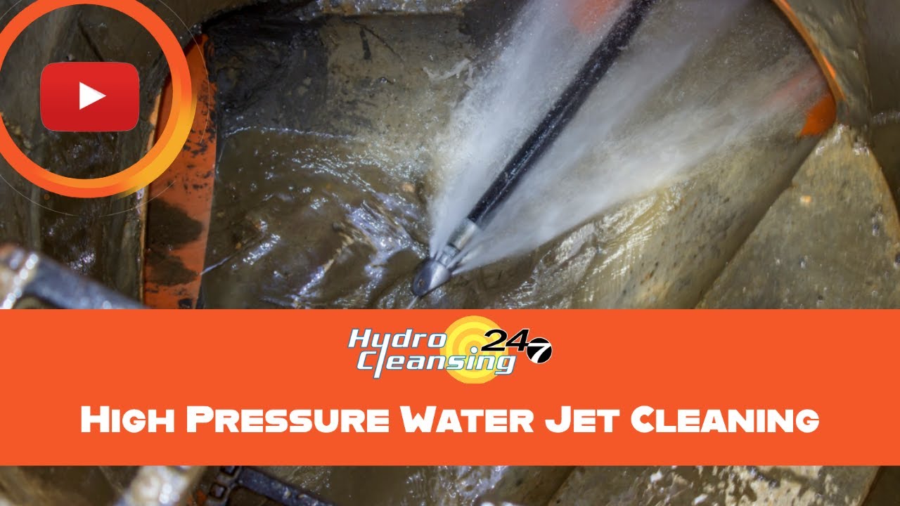 High-pressure water cleaning sewer pipes in action